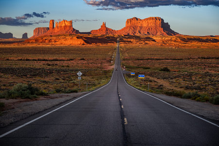 Forrest Gump Point at sunrise. Majestic view of the long road leading to Monument Valley, Natural landmark on the Arizona-Utah border, United States. Famous filming locationの写真素材