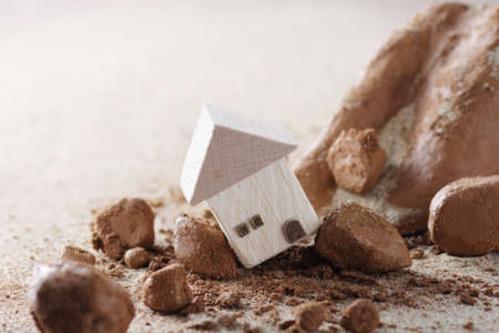 Diorama model of houses and rescuers collapsed in mudslideの写真素材