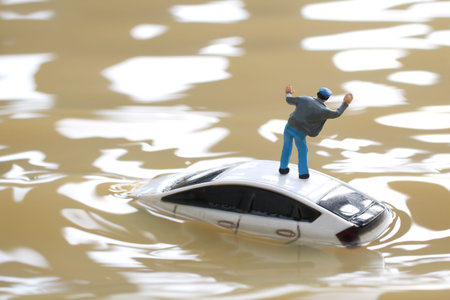 Diorama of cars stuck in floodwaters and people seeking help