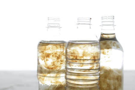 Plastic bottles floating on the surface of the sea polluting the seaの写真素材