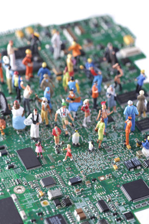Miniature human doll on computer base