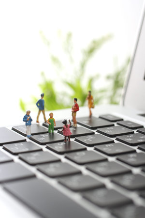 Diorama of a man on a laptop keyboard