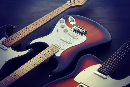 Group photo of various types of electric guitars