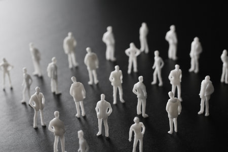 A collection of miniature dolls arranged in an orderly mannerの写真素材