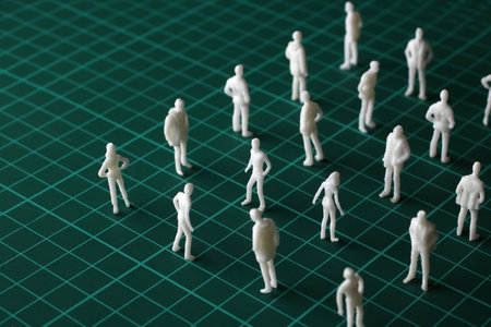 A collection of miniature dolls arranged in an orderly mannerの写真素材