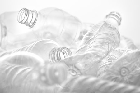 Lots of plastic bottles stacked on white transparent backgroundの写真素材