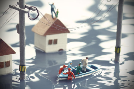Diorama of a flooded city and rescue teams doing rescue operations in lifeboatsの写真素材