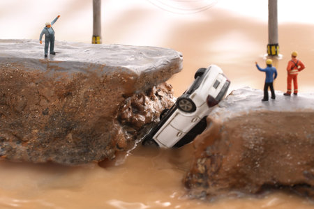 Diorama of levee breach due to heavy rain and people calling for help