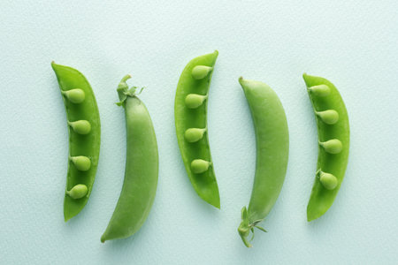 Image photo of peas taken on a light pastel green backgroundの写真素材
