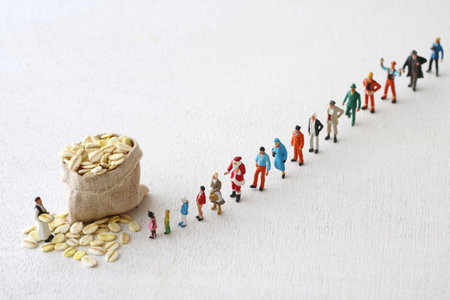 Diorama of people waiting in line for food aidの写真素材