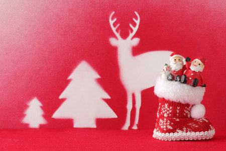 Christmas miscellaneous goods placed on construction paper with silhouettes of Christmas itemsの写真素材
