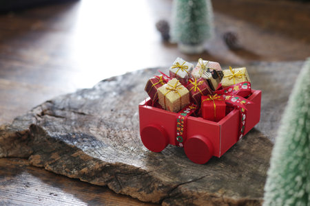 A Christmas present came to a stump in the forestの写真素材