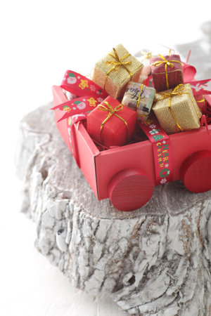 Christmas gifts placed on a stumpの写真素材