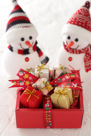 Santa Claus pulled a box of Christmas gifts with a sleighの写真素材