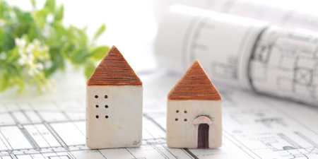 Image of a model of a house and a blueprint of my homeの写真素材