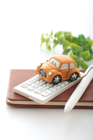 Image of car insurance with a miniature carの写真素材