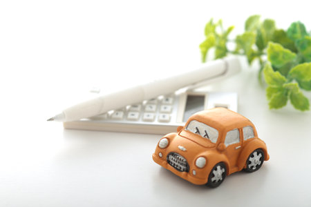 Image of car insurance with a miniature carの写真素材