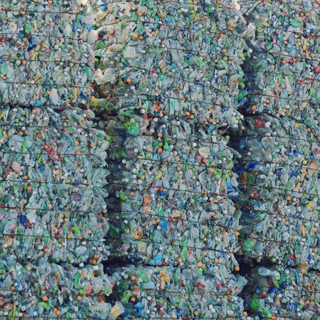 Piles of plastic bottles at a recycling facility