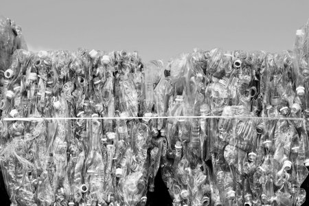Piles of plastic bottles at a recycling facilityの写真素材