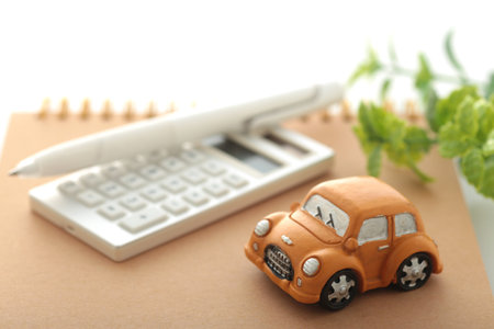 Image of car insurance with a miniature carの写真素材