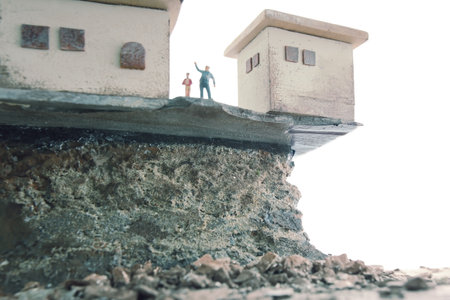 A house on the verge of collapse due to a landslideの写真素材