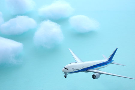 Airplanes and clouds flying in the blue skyの写真素材