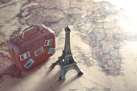 Image of overseas travel using a world map, an airplane and a model of the Eiffel Towerの写真素材