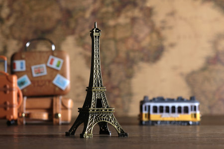 Image of overseas travel using a world map, an airplane and a model of the Eiffel Towerの写真素材