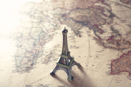 Image of overseas travel using a world map, an airplane and a model of the Eiffel Towerの写真素材