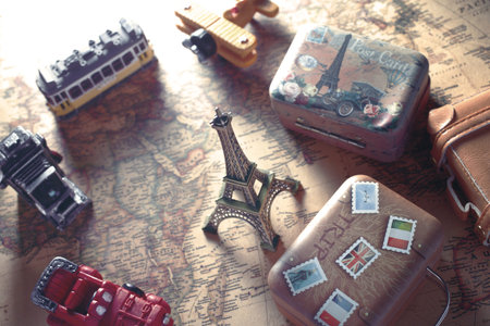 Image of overseas travel using a world map, an airplane and a model of the Eiffel Towerの写真素材