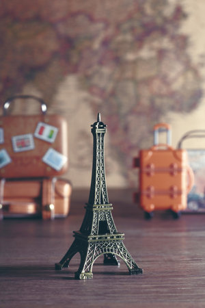 Image of overseas travel using a world map, an airplane and a model of the Eiffel Towerの写真素材