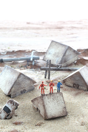 Diorama model of a house collapsed due to a disaster and the cityの写真素材