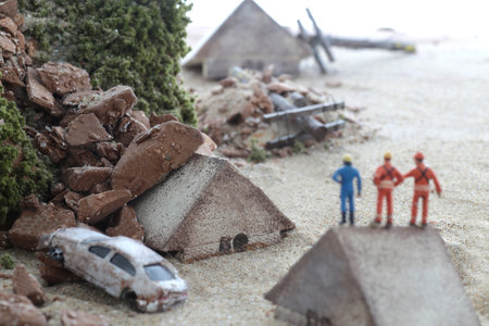 Diorama model of a house collapsed due to a disaster and the cityの写真素材