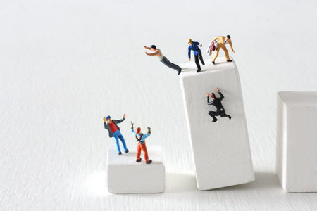 Miniature doll climbing the stairs of blocks and life planningの写真素材