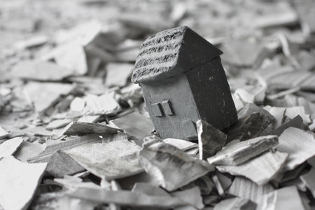 Diorama of people staring at the houses and rubble destroyed by the disasterの写真素材