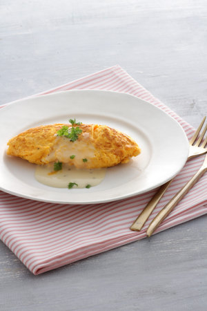 Restaurant omelette served on a white plate
