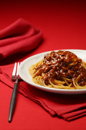 Italian bolognese pasta served in a restaurantの写真素材