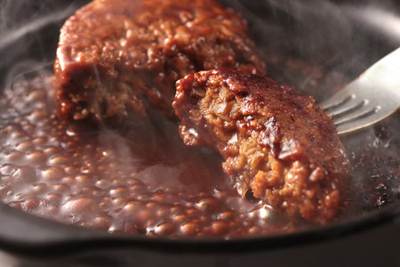 Juicy and delicious looking hamburger steak served on a plateの写真素材