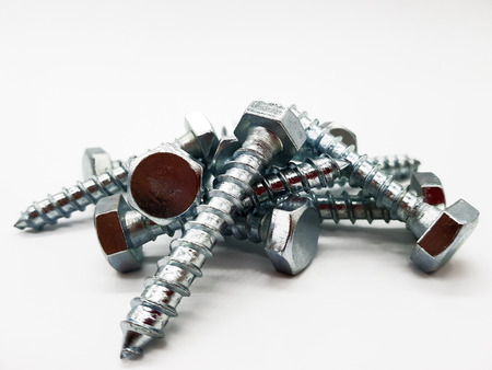 Screws released on white backgroundの写真素材