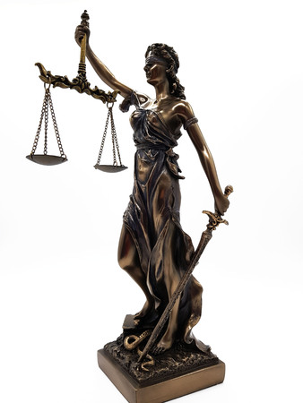 Justice statue isolated on a white backgroundの写真素材