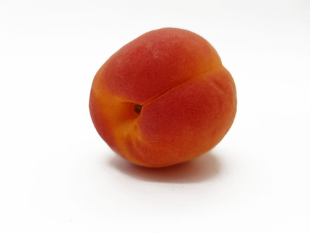 Fresh apricot isolated on a white backgroundの写真素材