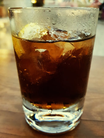 Glass of whiskey cola on ice
