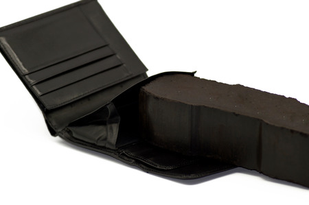 Coal in wallet purse isolated on white backgroundの写真素材