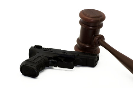 Gun law, gun released on neutral background