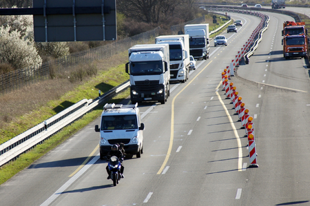 Motorcycle and TRUCK on the Highwayの写真素材