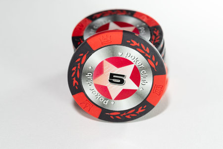 5 red casino chips on a white background