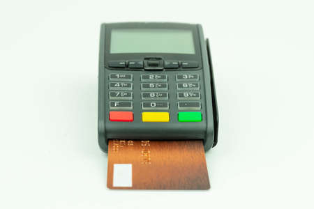 Payment terminal with inserted bank card insolated on whiteの写真素材