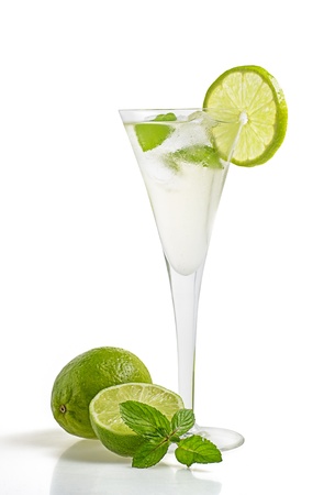 Drink with lime and mint in a champagne glassの写真素材