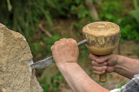 sculptor working on a stone sculptureの写真素材