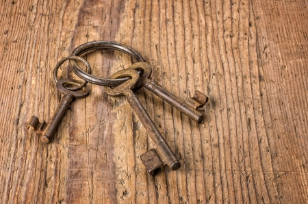 Three old keys on a key ringの写真素材